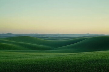 Rolling green hills at dawn. Soft light paints a landscape of gentle slopes