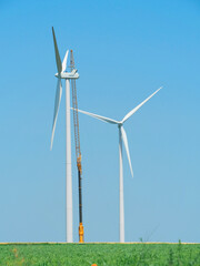 Wind turbine under maintenance with crane
