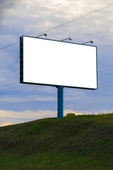 White billboard along the highway. Background for design and advertising.