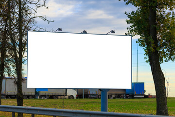 Background for design. Advertising billboard along the road in the city on a sunny day