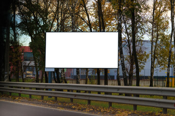 White billboard along the highway. Background for design and advertising.