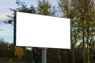 White billboard along the highway. Background for design and advertising.