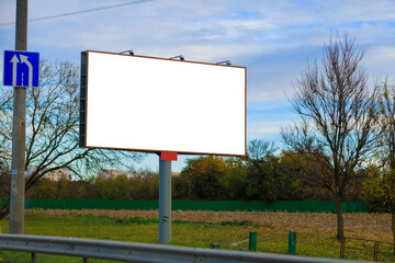 White billboard along the highway. Background for design and advertising.