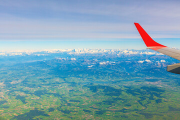 Aerial view on the Swiss Alps with snow peaks