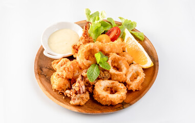 Fried squid : Tender calamari rings coated in seasoned batter,  served with Tartar Sauce