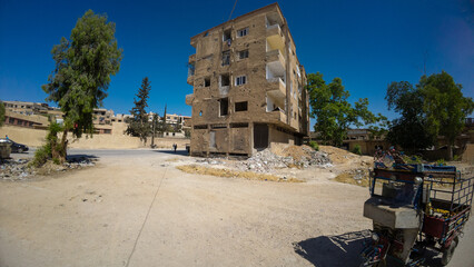 Dilapidated Apartment Building with Debris In Damascus Jobar district, Syria