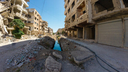War-Torn Urban Street with Damaged Buildings In Damascus Jobar district, Syria