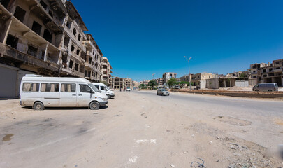 Obraz premium Deserted Urban Street with Damaged Buildings In Damascus Jobar district, Syria
