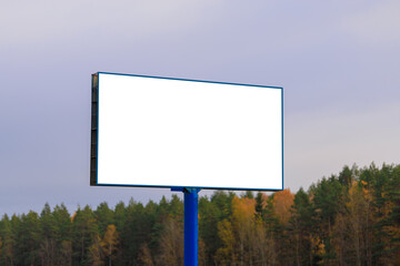 Advertising billboard along the road in the city. Background for design. 