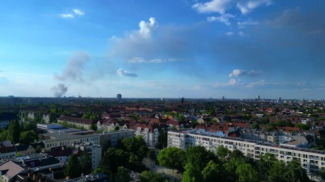 Yellow rescue helicopter landing in a Berlin urban park during a dust emergency. Great aerial view flight drone panorama overview drone