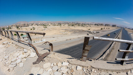 Deserted Landscape with Highway and Abandoned Buildings In Damascus Jobar district, Syria
