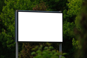 Background for design. Advertising billboard along the road in the city on a sunny day
