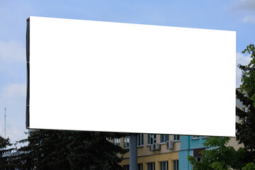 Fototapeta premium White billboard along the highway. Background for design and advertising.