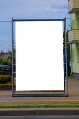 Background for design, white billboards on city streets and along roads in the summer day