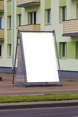 Background for design, white billboards on city streets and along roads in the summer day