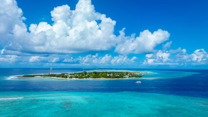 The aerial view with cloud sky in the local village island with white sand beach as coastline in summer Maldives © SASITHORN