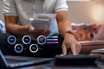 Businessman calculating tax with laptop, calculator, and financial documents tax payment planning, and digital financial services concept.
