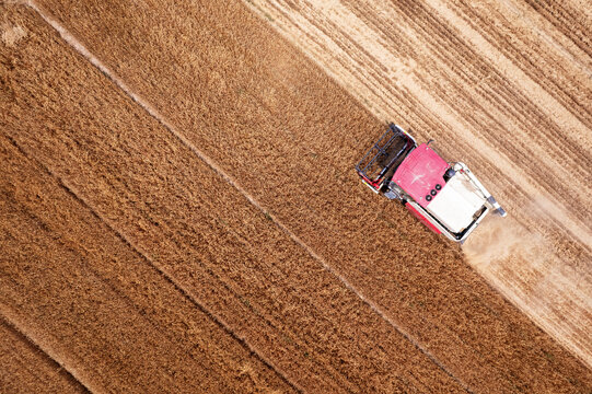 Aerial View of a Farm Tractor Working a Field