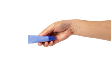 Purple packaging for cream, sunscreen or serum in hand on transparent background.