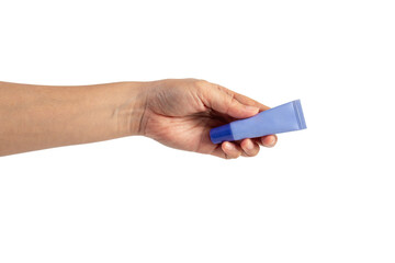 Purple packaging for cream, sunscreen or serum in hand on transparent background.