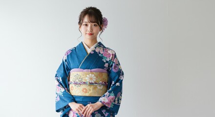 Kimono Elegance: A graceful woman, draped in the exquisite fabric of a traditional kimono, personifies timeless beauty and cultural heritage. Her pose radiates serenity and confidence.