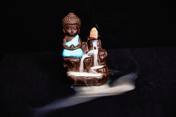 The meditating buddha idol smoke backflow effect, buddha, buddhism