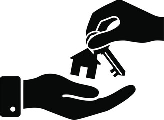 Hands exchanging a house key, symbolizing home ownership or property transfer.