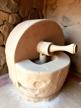 Stone Quern used mainly in ancient time to hand-grinding grain, seed into flour aka Jata, Atta Chakki, Saddle Quern, Muller; used in Hindu weddings as Jate Pujan [Translation: worship of Flour mill]