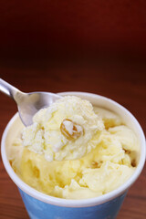 Closeup of mouthwatering rum raisin ice cream on a spoon