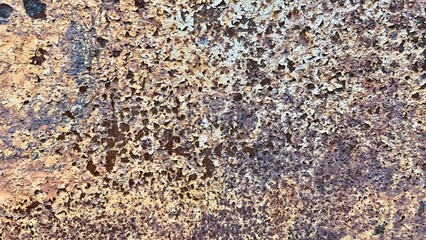 weathered rusted metal surface with peeling paint texture in earthy tones for industrial graphic,...