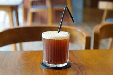 Black Peach Coffee, Indonesia, captured on June 16, 2025. A refreshing blend of bold black coffee and sweet peach flavor, served chilled for a fruity and aromatic twist.