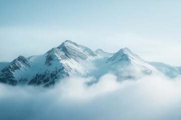 Obraz premium Snowcapped Mountain Range Emerging from Fog