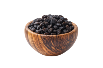 Black raisins in wooden bowl isolated on transparent background