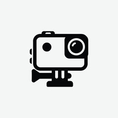 Modern black and white handheld camera icon with clean design, ideal for digital apps, tech UI, or media graphics. Features a lens, buttons, and portable grip on light gray background.