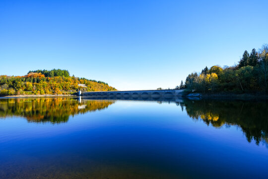 View of the Oleftalsperre Dam and the surrounding landscape. Nature at the lake near the Eifel National Park near Hellenthal in the Hohes Venn-Eifel Nature Park.
