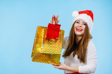 Happy Christmas woman with paper gift bags