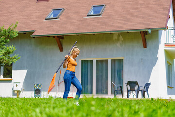 Woman with rake in garden