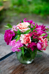 Beautiful bouquet of summer peonies flowers in a glass vase 