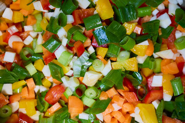 Mixed chopped vegetables for cooking, onion, yellow and red bell pepper, carrot