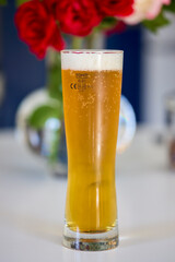 a glass of freshly poured beer