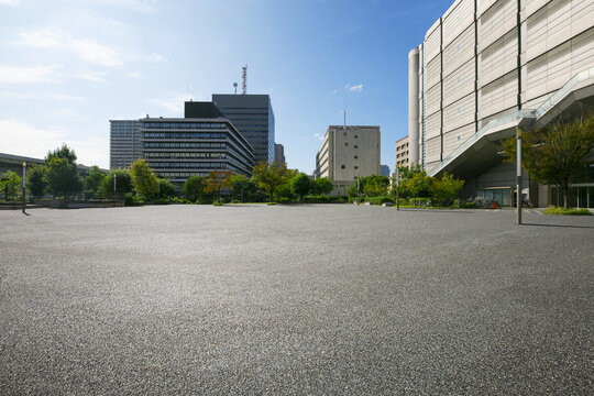 Asphalt road square and city skyline with modern buildings scenery at morning.