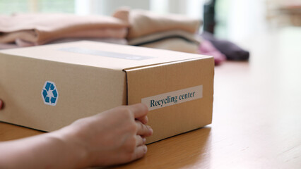Asia woman people dispose bin dump old undies pack donate box manage send used bra bank throw away. Happy asian eco go green home reduce net zero waste reuse cotton fabric fast fashion social issue.