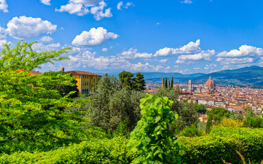 Villa Bardini, on a green hillside in the Medici district, offers a stunning panoramic view of Florence under a dramatic sky. Travel in Italy.