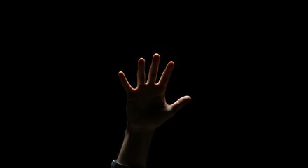 Reaching Hand with Fingers Outstretched Against Stark Black Background