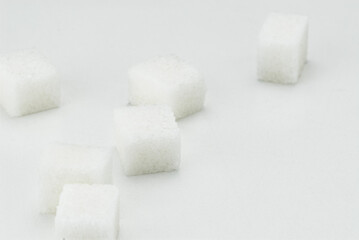 Close-Up of White Sugar Cubes Arranged on a Light Background