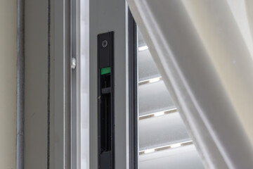 Obraz premium Window lock keeping home secure with venetian blinds providing privacy