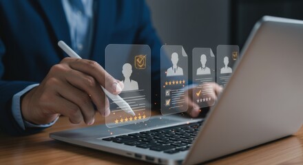 A person reviews candidate profiles on a laptop using a stylus for recruitment and talent management