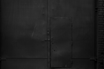 Old black metal wall. Dark grunge background