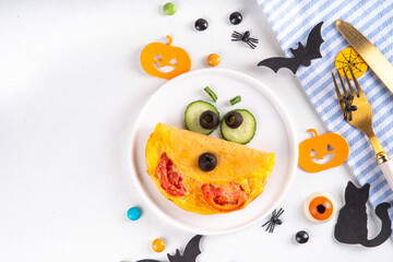 Halloween breakfast eggs omelet in form of monster