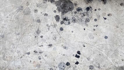 Grungy Concrete Oil Stains Surface, Perspective of a weathered concrete surface adorned with Oil stains paint splatters marks, illustrating the raw beauty of imperfection.